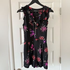 Express Black Romper with pink/purple/red floral print, size 2, zipper detail